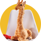 A large giraffe toy sitting on a chair
